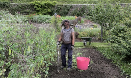 A gardener working amid the midges at Inverewe Gardens.