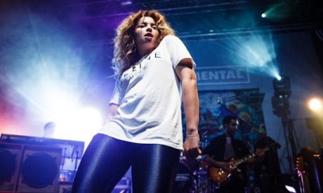 Ella Eyre and Ami Amor of Rudimental on stage.