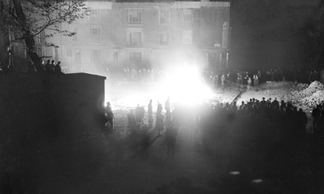 In Paddington, London, revellers celebrate the end of the war amid scenes of destruction. Photograph: Planet News Archive/SSPL/Getty Images