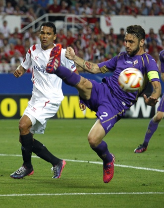 Carlos Bacca just misses an attempt, ahead of defender Gonzalo Rodriguez.