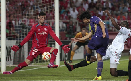 Sergio Rico stops a shot from Matias Fernandez.