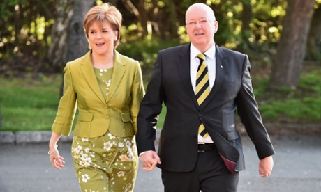 Nicola Sturgeon, votes with her husband Peter Murrell in Glasgow, Scotland.