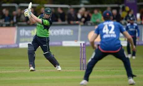 Ireland captain William Porterfield is bowled by Mark Wood.