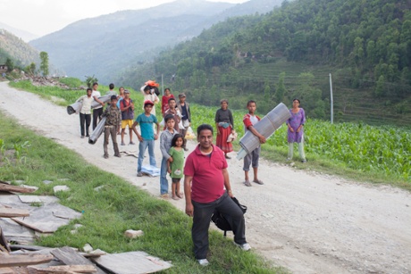 Nakul Khadka (front) with some Jalbire villagers for whom he managed to procure supplies, 2 May.