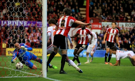 David Button saves on the line.