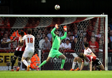 James Tarkowski sees his header go over.