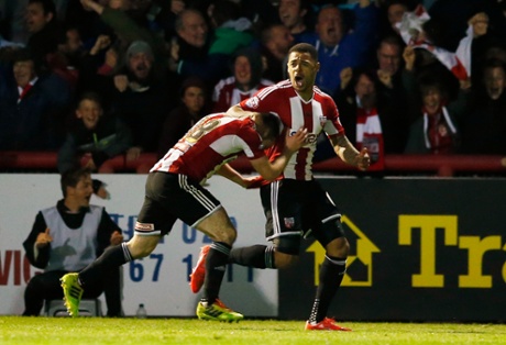 Andre Gray celebrates.