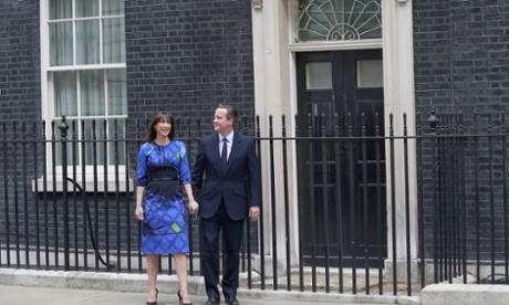 Prime Minister David Cameron and his wife Samantha Cameron walk out of No10 Downing St after securing a majority for the Conservative party  and a further five year term on 8 May.