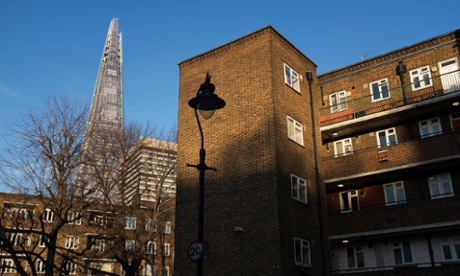 The Shard towers over a housing estate in London.