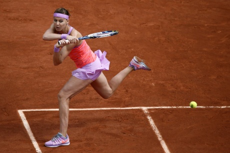 Lucie Safarova returns the ball to Maria Sharapova during their fourth-round match.