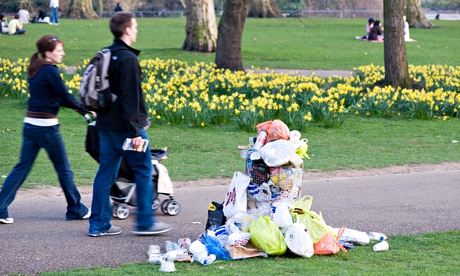 Overflowing litter bin in a park