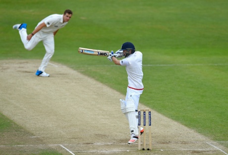 Adam Lyth cuts a ball to the boundary as New Zealand bowler Tim Southee looks on.