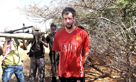 Michael Scott Moore surrounded by his Somali captors.