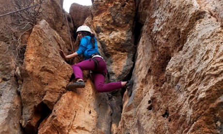 A young Palestinian woman learning to rock climb on the cliffs above Ein Qiniya outside the city of Ramallah on the West Bank. Despite an active climbing community in Israel, outdoor climbing venues for Palestinians have only been developed in the last twelve months. 