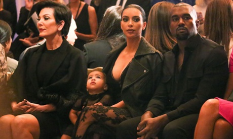 Kim, Kanye and little North West at the Givenchy show at Paris fashion week.