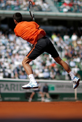 Djokovic returns the ball to Gasquet.
