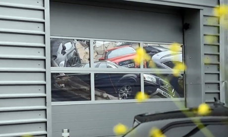 Damaged Audis at Milton Keynes dealership after roof collapse.
