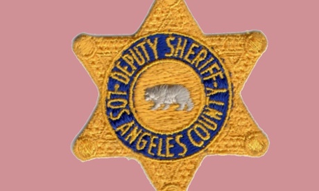 Five Los Angeles County sheriff's deputies are accused of beating a visitor to the jail.