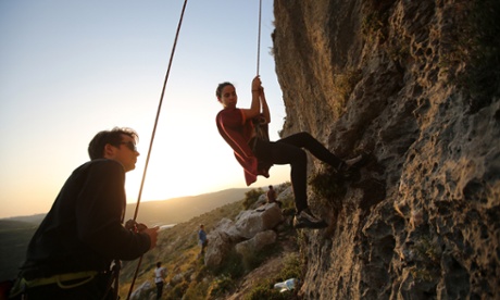 A group of Palestinians climb 