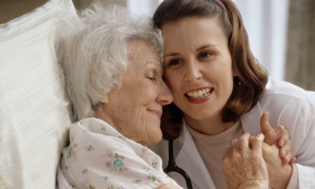 Patient in Hospital Bed Embracing Nurse
