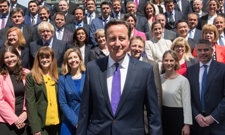 David Cameron poses for a group photo with newly elected Conservative MPs at the Houses of Parliament.