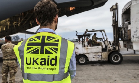 A DfID staff member supervises the unloading of UK aid in Kathmandu, Nepal, on 30 April. The flight is carrying vital stocks including shelter kits and solar lanterns in aftermath of earthquakes.