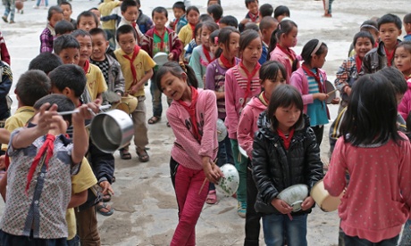 Left-behind children wait for lunch in a primary school of Maguang County, southwest China's Yunnan Province. 