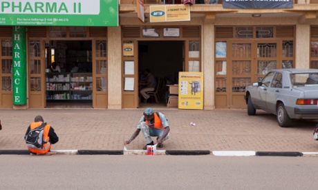 Painting the curbs of Kigali, Rwanda.