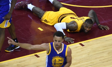 Cleveland Cavaliers LeBron James watches as Steph Curry and Golden State Warriors pull off a game 4 win in the NBA Finals.