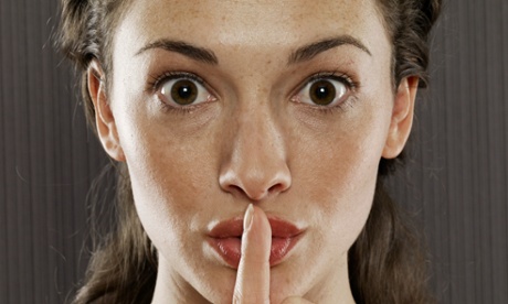 Women with finger on lips