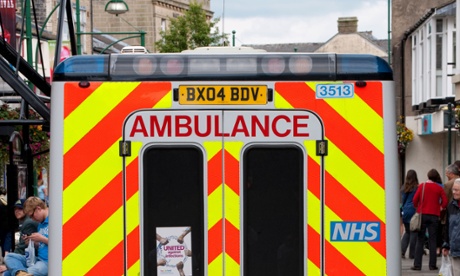 An ambulance in a busy high street