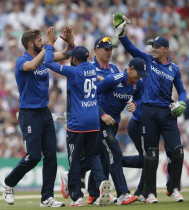 As Liam Plunkett receives his team-mates congratulations.