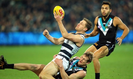 Geelong captain Joel Selwood fires off a handball against Port Adelaide