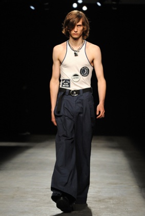 A model wearing flares and a vest on the Topman catwalk