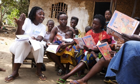 A social worker holds a workshop on nutrition for breastfeeding mothers in a poor area of Monrovia, Liberia.