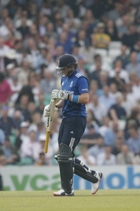 A dejected Joe Root heads off the pitch.