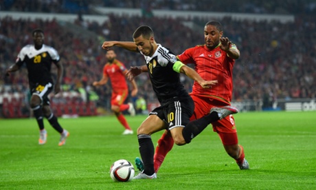 Ashley Williams challenges Eden Hazard as Wales defend their lead.