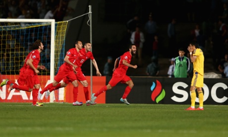 Arda Tutan celebrates scoring the winning goal for Turkey in Almaty, Kazakhstan.