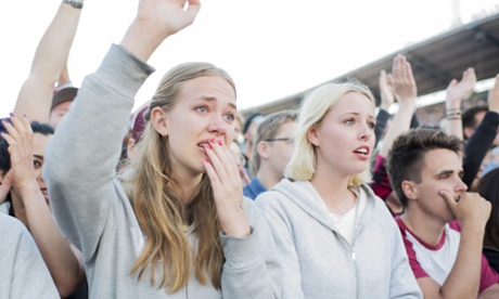 Fans react as Foo Fighters frontman Dave Grohl falls off the stage in Gothenburg.