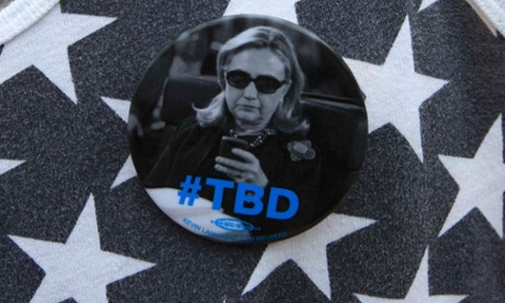 A supporter wears a campaign button before U.S. Democratic presidential candidate Hillary Clinton delivers her 