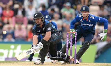 Ross Taylor gets down to play a shot as Jos Buttler reacts.