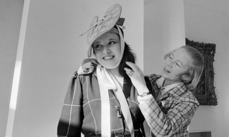 Carven, right, trying out a hat on a model in 1979.