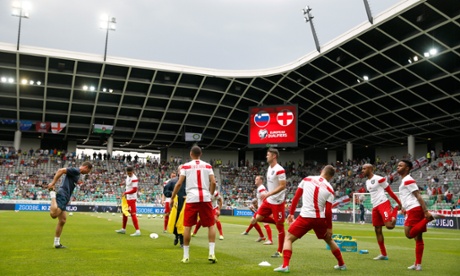 England players warm up before the start.