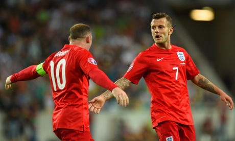 Jack Wilshere is congratulated by Wayne Rooney.