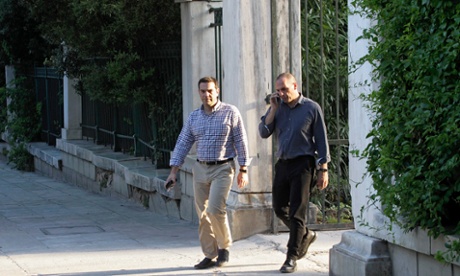 The Greek prime minister, Alexis Tsipras, left, and finance minister, Yanis Varoufakis, take a walk in central Athens.