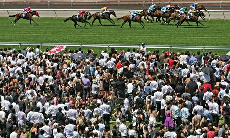 Spectators watching a race during the AAMI Victoria Derby Day at Flemington