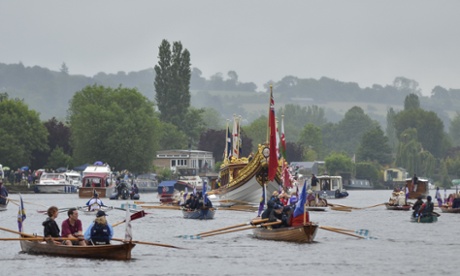 The royal barge Gloriana led a flotilla that carried a facsimile of Magna Carta in the Thames River Pageant on Saturday.