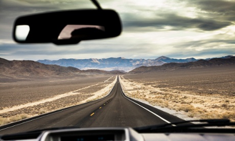 view of road from behind steering wheel