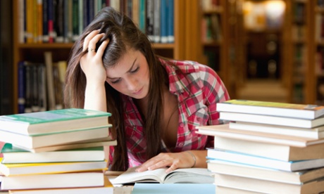 student studying books