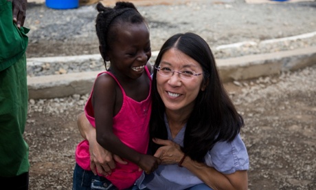 Joanne Liu hugs Ebola survivor Evelyn Sonpon.